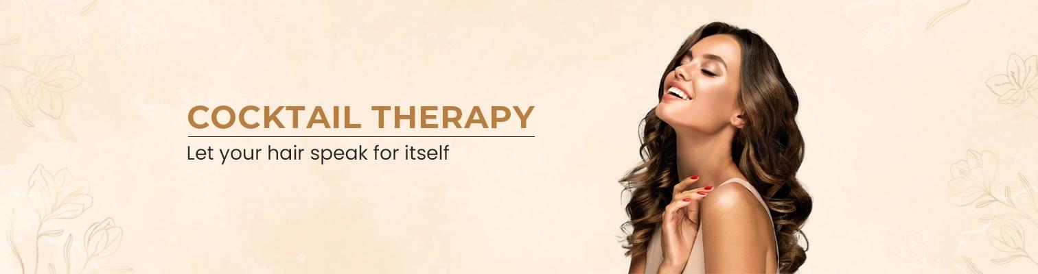 The girl holds the hair and shows the injection. She is advertising the Cocktail Therapy 